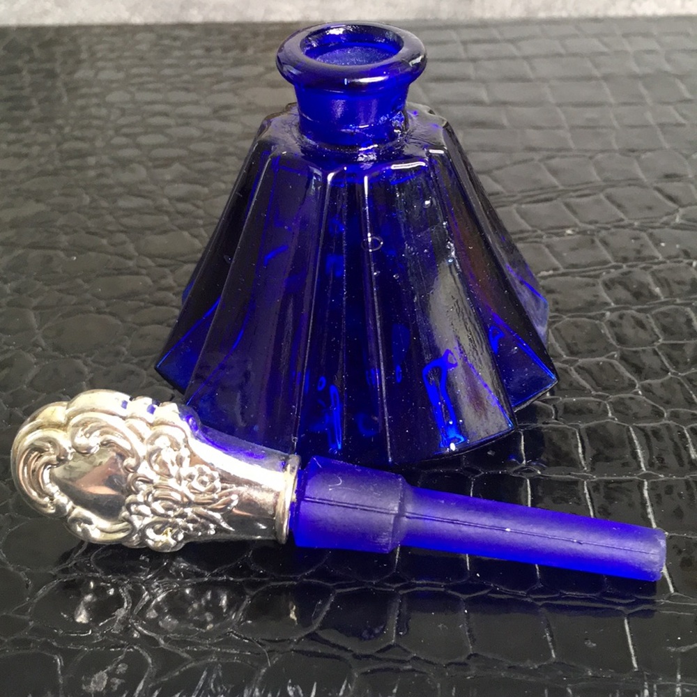 Blue glass bottle silver stopper